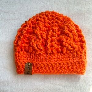 Blaze orange cable knit hunting hats are available in infant sizes.